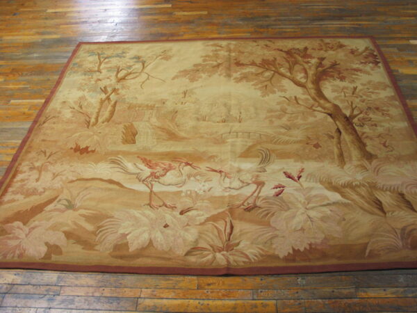 Square, low-pile rug in sepia tones depicts a nature scene with wading birds and tall trees on wood flooring.