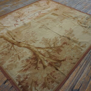 Large low-pile rug with a detailed beige and brown woodland scene resting on rough plank wood flooring.