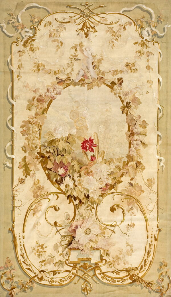 Cream and pale green rug displaying an elaborate floral bouquet, grapevine garlands, and golden scrolled cartouches.