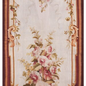 Ornate floral runner rug with a cream field, pink flowers, and a detailed maroon scrollwork border.