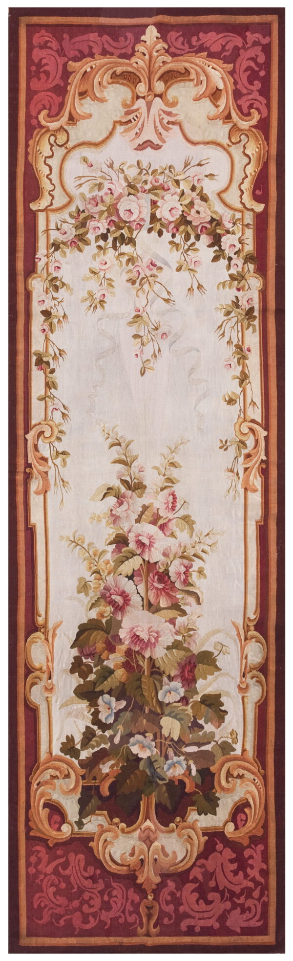 Ornate floral runner rug with a cream field, pink flowers, and a detailed maroon scrollwork border.