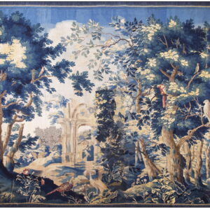 Navy blue and cream flat-woven tapestry depicting a dense woodland scene with birds and stone ruins.