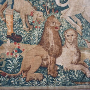 Detailed tapestry featuring animals and foliage.