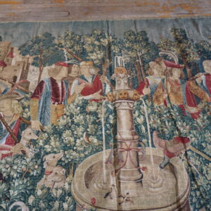 Colorful tapestry depicting historical scene.