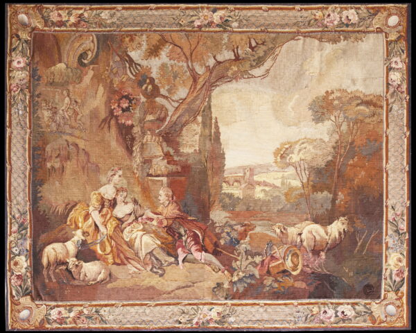 Flatwoven rug in browns and beige depicting a pastoral scene with figures and sheep, framed by a detailed floral border.