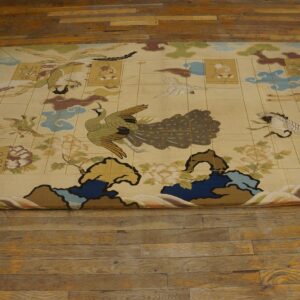 Low-pile beige rug with an illustrative pattern of stylized birds, clouds, and flowers on a wood floor.