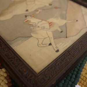 Textured area rug with alternating bands of red, cream, dark green, and yellow bobble weave.