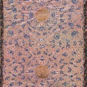 Pinkish-tan textile rug featuring blue floral vines, two central gold medallions, and a detailed dark border.