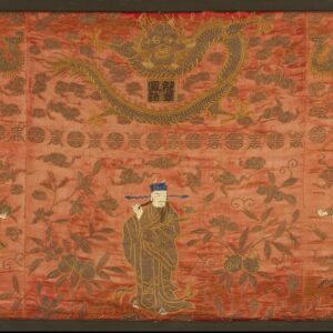 Flat vermilion textile art depicts figures, dragons, and flora embroidered in brown and metallic gold thread within a frame.