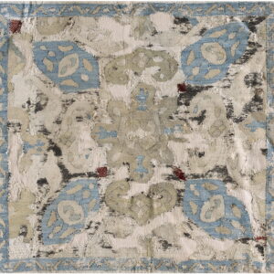 Distressed square swatch with an abstract floral pattern in light blue, cream, sage, and dark red, featuring a border.