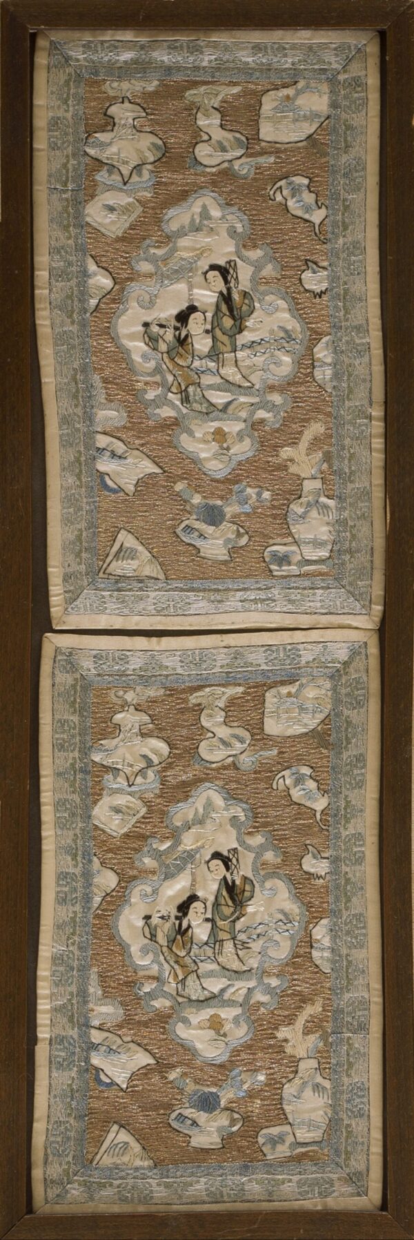 Highly textured brown and gold embroidered textile panels displaying blue and cream figural cartouches, framed in wood.