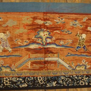 Low-pile tapestry with sienna ground and detailed scene of children, bridge, trees, and a black and blue floral border.