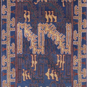 Vertical blue rug with tan and rust tribal geometric patterns, including stylized animal figures and borders.