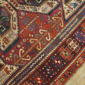 Colorful intricate patterned wool rug