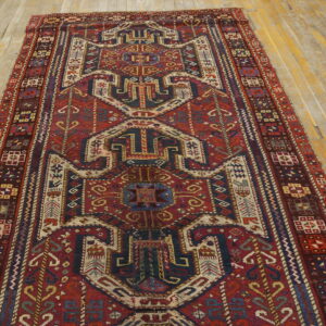 Colorful intricate patterned vintage rug