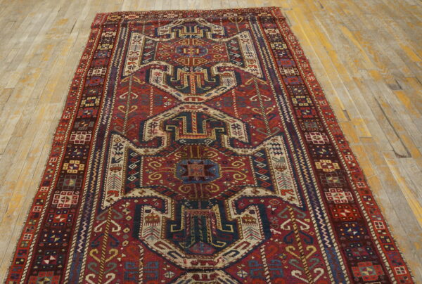 Colorful intricate patterned vintage rug