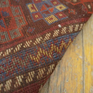 Colorful patterned wool rug corner