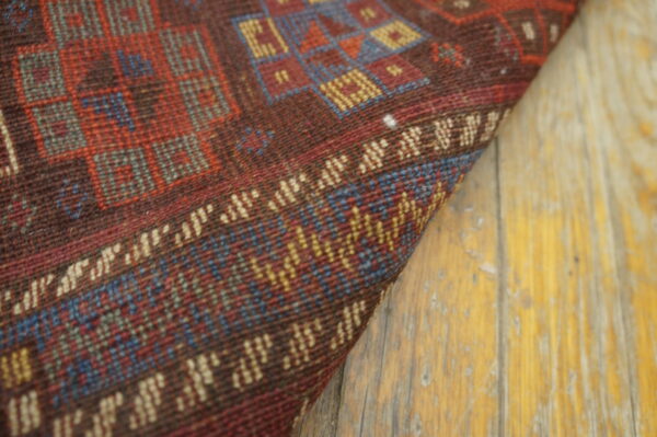 Colorful patterned wool rug corner