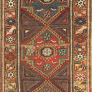 Vertical runner featuring intricate red, deep blue, and gold geometric stepped medallion designs.