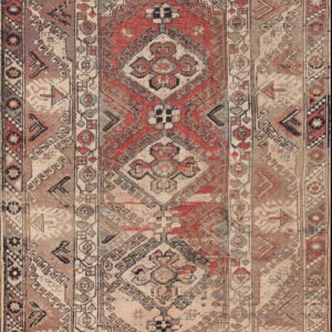 Geometric low pile rug with a central medallion in faded red, beige, gray, and brown colors.