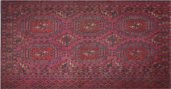 Deep red geometric rug featuring repeating navy and tan medallions and multiple ornate borders.