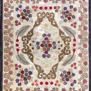 Floral hooked rug featuring a cream background, purple border, and multicolored bouquets with brown scrollwork.