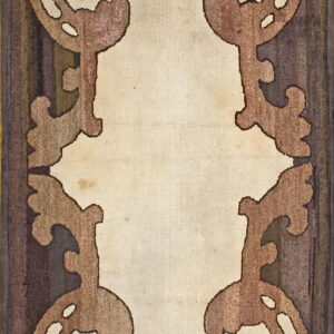 Rectangular rug with a light beige center field framed by ornate brown scrolling motifs and a dark striped border.