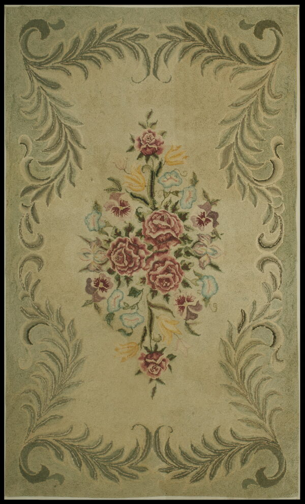 Textured sage green rug centered with a colorful floral bouquet and framed by scrolling olive leaves.