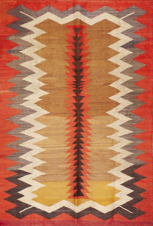 Flat woven rug in red, tan, and brown featuring vertical zigzag borders and a central arrow pattern.
