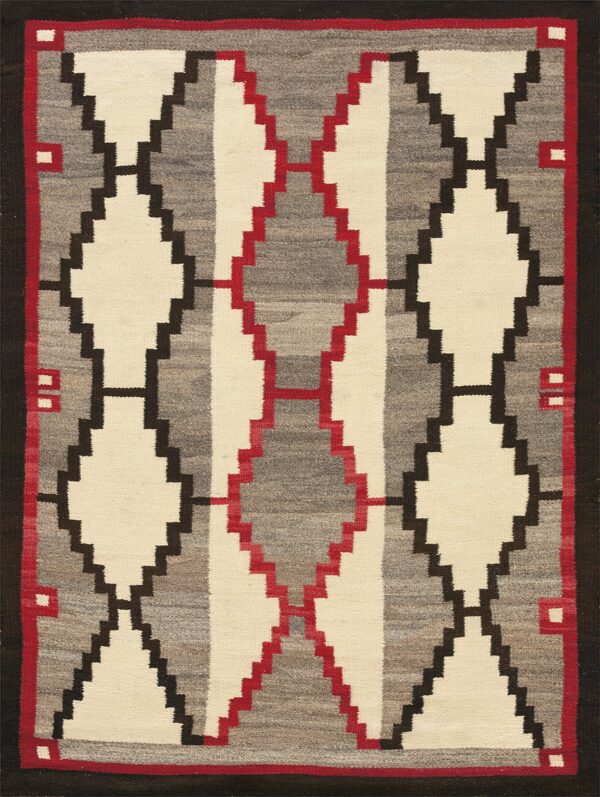 A flatwoven textile with vertical stepped diamonds in cream, variegated gray, black, and red.