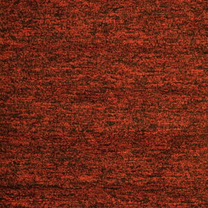 A speckled, textured rug surface in dense rust red and black fibers.