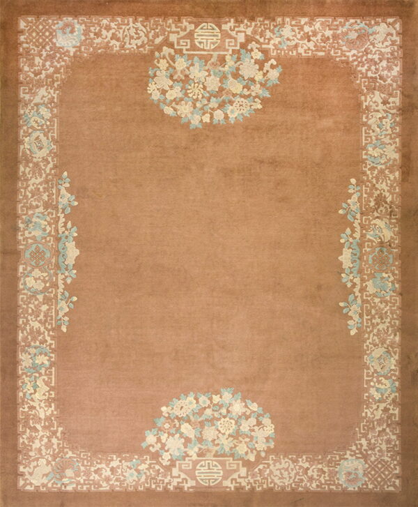 Terracotta rug featuring intricate cream, pale blue, and pink traditional floral and geometric motifs.
