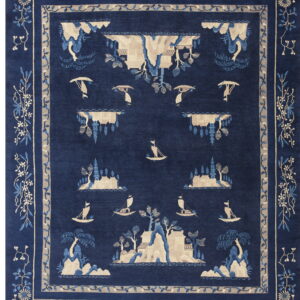Detailed beige and blue chinoiserie landscape scene on a deep indigo field with decorative floral borders.