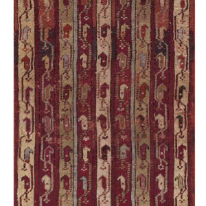 Red, tan, and gray rug with vertical striped bands containing stylized abstract figures.