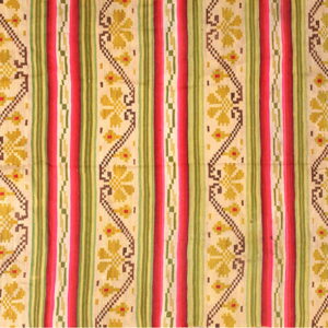 Multicolor flat woven rug featuring vertical bands of red, green, beige, and yellow geometric floral patterns.