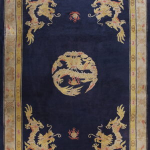Deep blue pile rug with gold dragon motifs, including a central medallion and ornate beige border.
