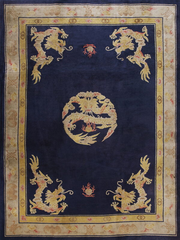 Deep blue pile rug with gold dragon motifs, including a central medallion and ornate beige border.