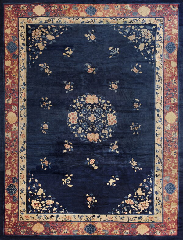 Blue antique rectangle wool chinese - peking knotted room size 1930s rug 1 Navy blue rug featuring tan and rose floral patterns, surrounded by a complex reddish-pink and cream border.