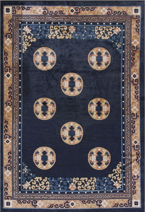 Dark indigo rug with large tan and blue medallions surrounded by complex scrollwork and geometric borders.