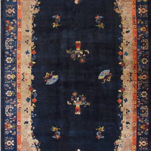 Dark navy rug with a detailed oval beige border featuring pagodas, flowers, and terracotta accents.