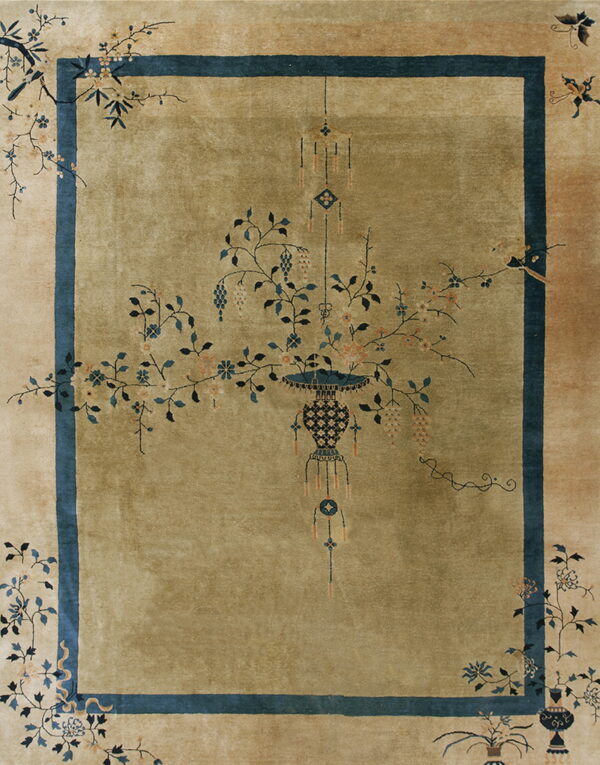 Olive rug with a central stylized vase and floral motif within a dark blue border.