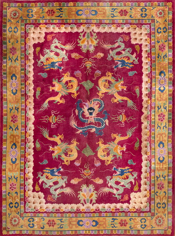 Magenta rug with detailed gold and blue dragon motifs centered inside a complex gold and floral border.