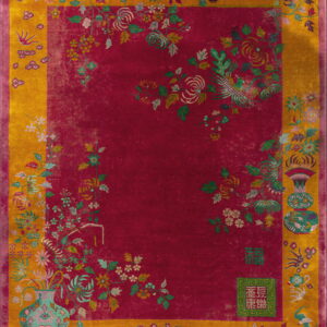 Magenta rug with a gold border features intricate floral sprays, vases, birds, and subtle Chinese characters.