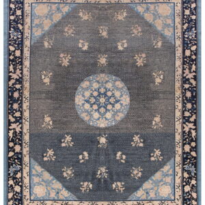 Traditional dark blue rug with beige floral details, a central medallion, and layered light blue floral borders.