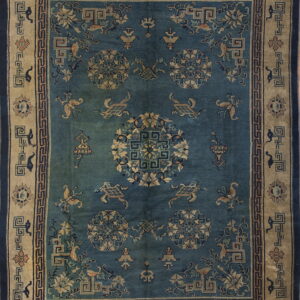 Dark teal rug with tan borders and a detailed pattern of medallions, stylized creatures, and geometric motifs.