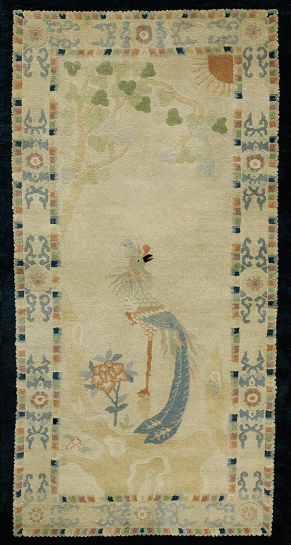 Beige runner rug with a bird and tree pattern, framed by a border of muted blue, green, and rust tones.