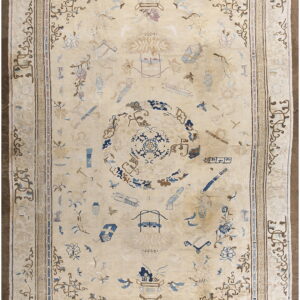 Cream-colored rug featuring scattered pale blue and tan motifs within a detailed, multi-layered border.