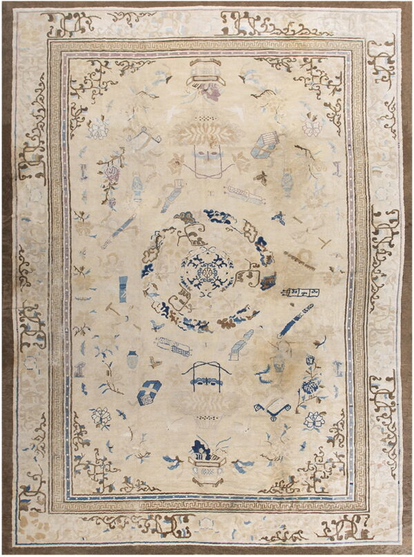 Cream-colored rug featuring scattered pale blue and tan motifs within a detailed, multi-layered border.