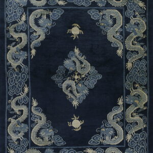 High-pile navy rug with light-colored dragon and cloud motifs in the border and field.