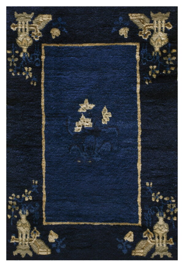 Plush dark navy rug with a framed central field and detailed gold and dark blue ornate border patterns.